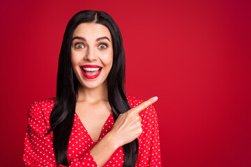 Close-up portrait of gorgeous cheerful lady demonstrating aside copy space ad advice isolated over...