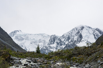 view of the snow-capped Belukha peak from the shore of lake Akkem