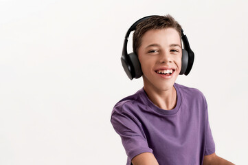 Close up portrait of happy teenaged disabled boy with cerebral palsy in headphones smiling at camera, using his walker isolated over white background