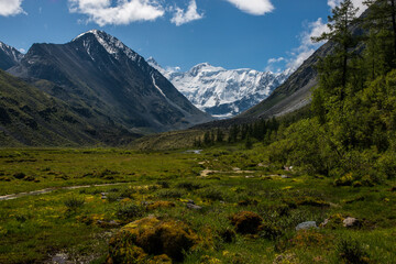 view of the snow-capped Belukha peak from the shore of lake Akkem