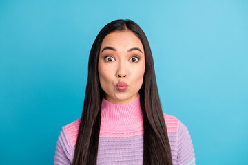 Close-up portrait of nice girl wearing turtleneck sending kiss Valentine day isolated over bright blue color background