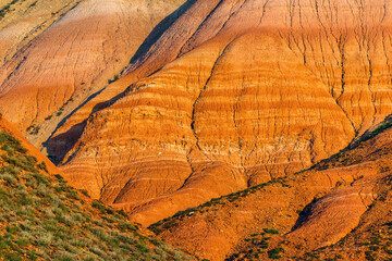Big Bogdo mountain. Red sandstone outcrops on the slopes sacred mountain in Caspian steppe Bogdo -...