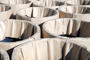 Goods in the warehouse. Modules or fragments of stainless steel pipes for chimneys. Modular chimney, close-up