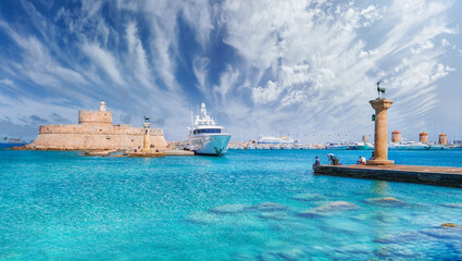 Landscape with Mandraki Harbour and two statues, Elefos and Elafina in Rhodes Island, Greece - obrazy, fototapety, plakaty