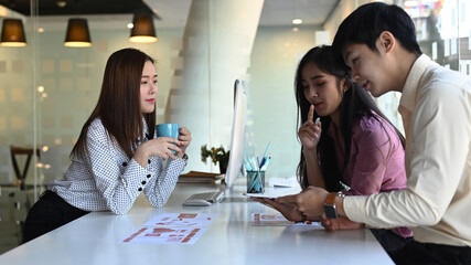 Image of group of young creative is discussing and brainstorming ideas about development mobile application project in modern office.