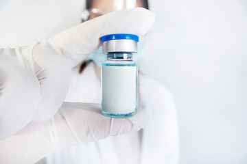 Doctor holding vaccine mock up and Development and creation of a coronavirus vaccine on white background.