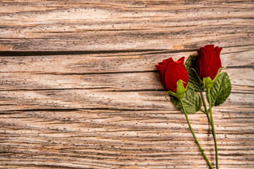 Fototapeta na wymiar flowers on wooden background. Fictional details captured. Top view under natural light