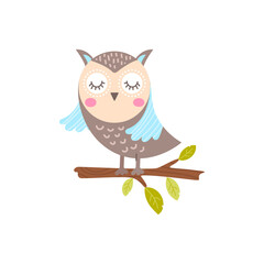 A cute owl sits on a branch with leaves.