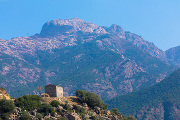 Abandoned house on the hill. Mountain view as a background. Near the capital city, Ajaccio, Corsica