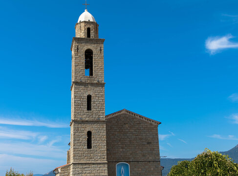 View of the church and bell tower of Our Lady of Church of Eglise Notre Dame Misericorde, Corsica France