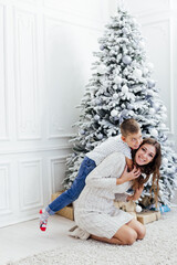 Mom and boy decorates Christmas decoration Christmas Christmas Christmas New Year