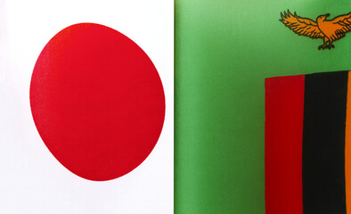fragments of the national flags of Japan and the Republic of Zambia close-up