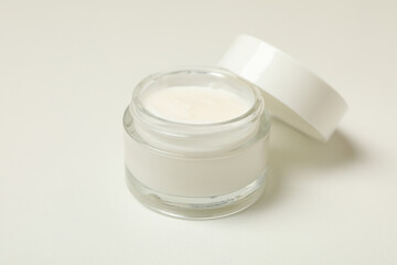 Jar of cosmetic cream on white background, close up