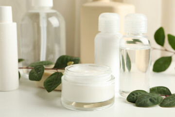 Spa cosmetic products on white table, close up