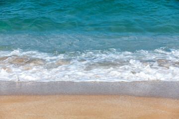 Fototapeta na wymiar Sand beach and sea foam