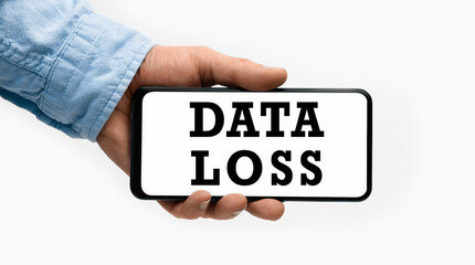 Closeup of a male hand holding Smartphone with text Data Loss on display
