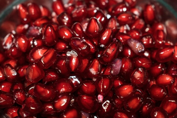 Juicy red and fresh pomegranate fruits with white seeds