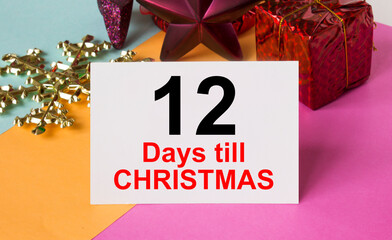 Christmas tree decorated with toys and tinsel, gift boxes and greeting card with text 12 Days till...