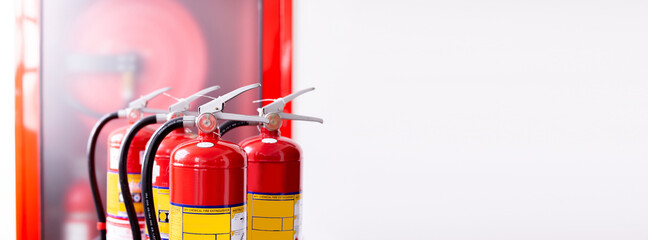 The red fire extinguisher is ready for use in case of an indoor fire emergency.	
