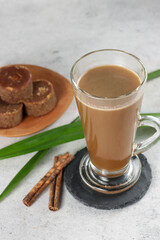 Bajigur. Javanese traditional hot drink of herbal coffee latte made from coconut milk, coffee, ginger, palm sugar and cinnamon.