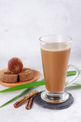 Bajigur. Javanese traditional hot drink of herbal coffee latte made from coconut milk, coffee, ginger, palm sugar and cinnamon.