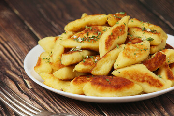 Polish dish kopytka served at the table