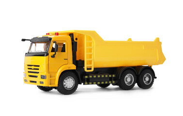 Yellow toy tipper truck isolated on white