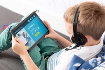 Remote learning concept with boy using tablet