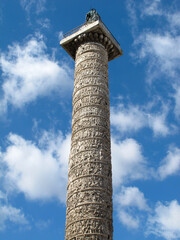 A view from below of Trajan's Column in Rome, Italy.  It is known as Colonna Traiana in Italian, and is a triumphal column that commemorates a war victory that was completed in AD 113.