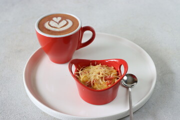cup of coffee and macaroni schotel