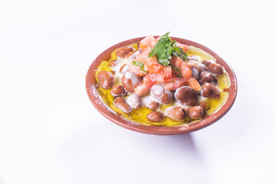 foul or ful Modammas Fava Beans Traditional Dish of Beans for all arab - White background 
