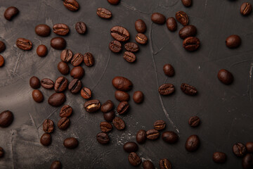 Composition with a coffee beans on a textured plastered background with a variety of arbitrary stains