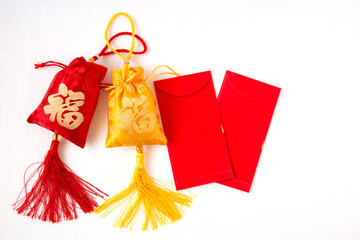 Lunar New Year decoration with lucky sack isolated on white . Tet Holiday.Translation of text appear in image: fortune good luck