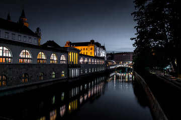 Ljubljana the capital of Slovenia. View of the old town of Ljubljana and the river Ljubljana. Night landscape of the city. 