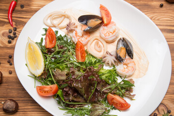 a platter of vegetables and seafood