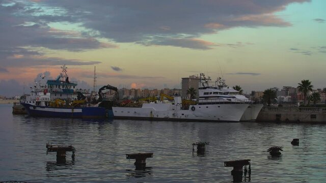 Tripoli, Libya - November 25, 2020: The port of Tripoli during sunset on a normal working day.