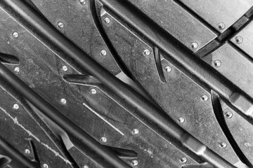 Summer car tire. Tire stack background. Car tyre protector close up view. Black rubber tire...