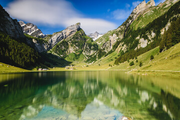 Naklejka na ściany i meble Alpine lake in the mountains (Seealpsee, Switzerland)
