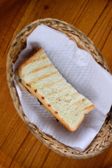 Delicious toast in a basket on the table. Delicious breakfast concept in the morning