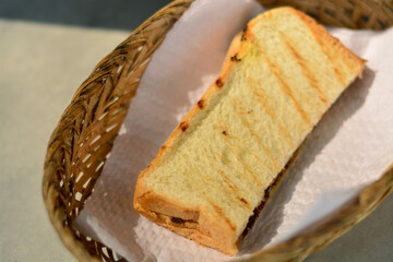 Close up of delicious toast in the basket on the table. Breakfast concept