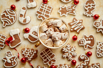 Cup of hot chocolate and Christmas shaped gingerbread cookies