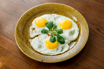 fried eggs-three eggs with herbs