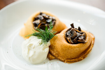 baked pancakes with mushrooms and sour cream