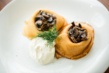 baked pancakes with mushrooms and sour cream