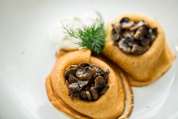 baked pancakes with mushrooms and sour cream