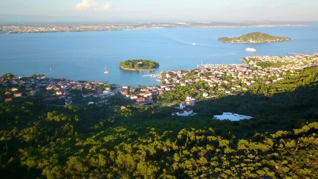 Flight over the city of Preko. Zadar and the Velebit mountains in the background Croatia 4K