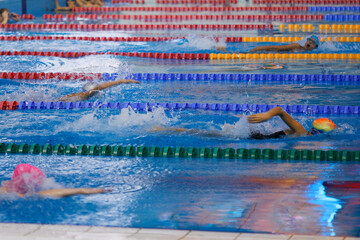children athletes swim in the pool workout