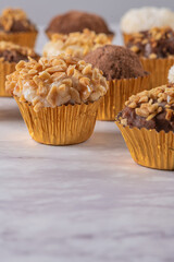 Brigadeiro is a common Brazilian dessert. Delicious chocolate candy Brigadeiro on a table