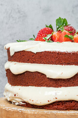 Red velvet cake on wood board. Strawbwrry cake. Devils cake. Wedding dessert. Birthday party. Delicious dessert. Traditional american dessert.