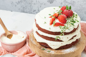 Red velvet cake on wood board. Strawbwrry cake. Devils cake. Wedding dessert. Birthday party. Delicious dessert. Traditional american dessert.